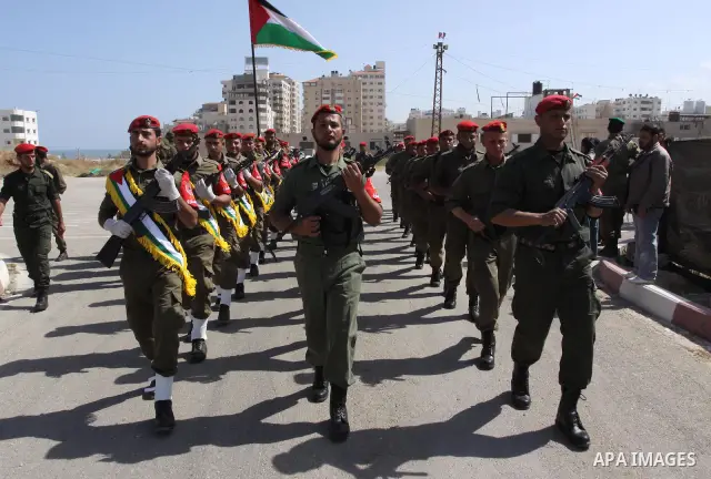 Palestinian Hamas National security force officers stand to attention during their graduation ceremony in Gaza City on April 19, 2012. Photo by Mohammed Asad