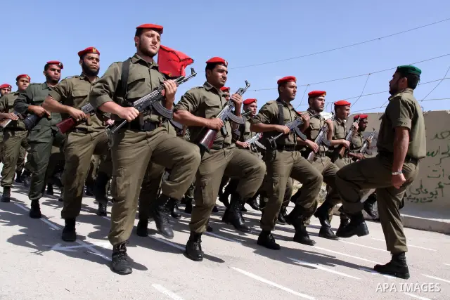 Palestinian Hamas National security force officers stand to attention during their graduation ceremony in Gaza City on April 19, 2012. Photo by Mohammed Asad