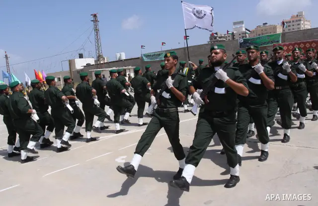 Palestinian Hamas National security force officers stand to attention during their graduation ceremony in Gaza City on April 19, 2012. Photo by Mohammed Asad