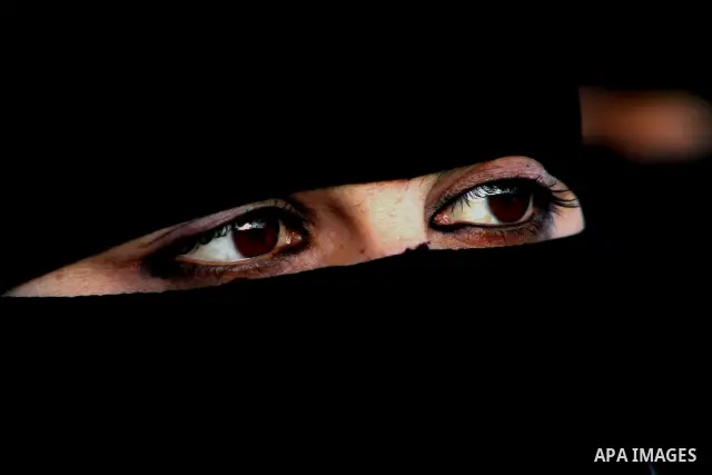 A Palestinian woman participate in a demonstration calling for the release of Palestinian prisoners jailed in Israel, near the Erez border crossing between Israel and the northern Gaza Strip, on April 19, 2012. Photo by...
