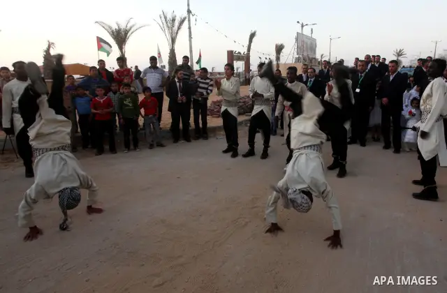 Palestinians celebrate during a mass wedding organized by Association of Altayseer for marriage. Around 60 young Palestinians Participated in the wedding in Gaza City on April 19, 2012. Photo by Ashraf Amra