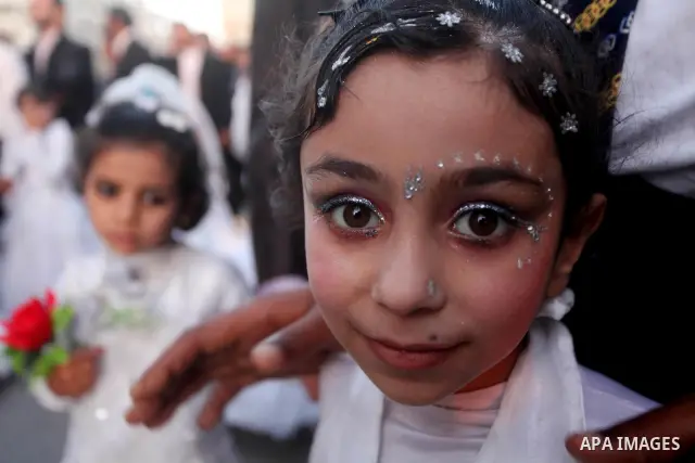 Palestinians celebrate during a mass wedding organized by Association of Altayseer for marriage. Around 60 young Palestinians Participated in the wedding in Gaza City on April 19, 2012. Photo by Ashraf Amra