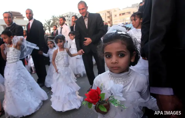 Palestinians celebrate during a mass wedding organized by Association of Altayseer for marriage. Around 60 young Palestinians Participated in the wedding in Gaza City on April 19, 2012. Photo by Ashraf Amra