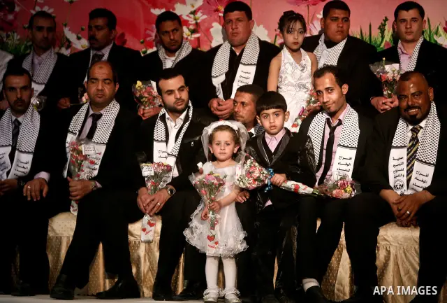 Palestinians celebrate during a mass wedding organized by Association of Altayseer for marriage. Around 60 young Palestinians Participated in the wedding in Gaza City on April 19, 2012. Photo by Ali Jadallah