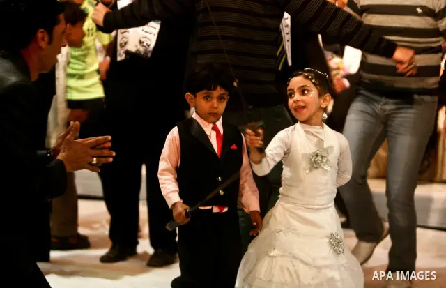 Palestinians celebrate during a mass wedding organized by Association of Altayseer for marriage. Around 60 young Palestinians Participated in the wedding in Gaza City on April 19, 2012. Photo by Ali Jadallah