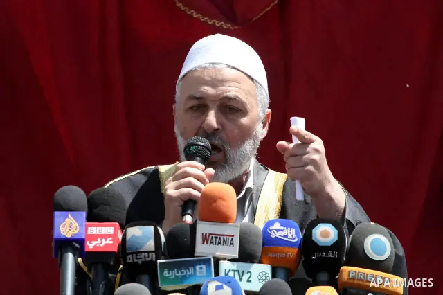 Palestinian Minister of Justice in Gaza Mohammed Al-Ghool talks attend a protest in solidarity with Palestinian prisoners being held in Israeli jails, following the Friday noon prayers, in Gaza City, on April 20, 2012. P...