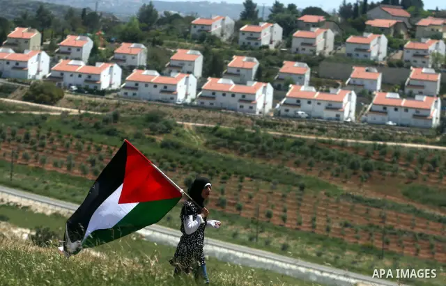 Palestinian and foreign activists confront Israeli soldiers during clashes in the weekly Friday demonstration in the West Bank village of Nabi Saleh, on April 20, 2012, against the construction of the nearby Jewish settl...