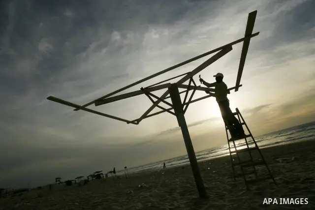 Palestinian workers put their tents on Gaza beach to preparation for the summer season, on April 20, 2012. Photo by Photo by Eyad Al Baba