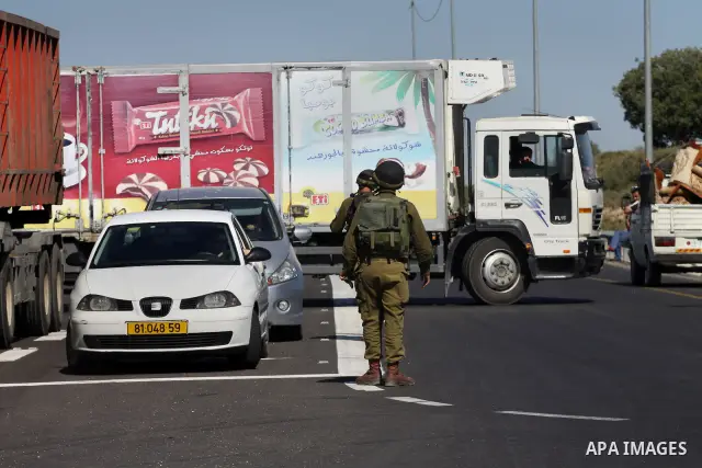 Israeli soldiers closed Tappuah checkpoint, after arrested two Palestinians young their has a pistol and explosion materials. southern Nablus city in the west bank,on April 21, 2012. Photo by Nedal Eshtaya
