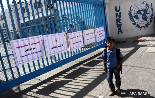 Palestinians participate during a protest in front of the UNRWA office against the mechanism Intelligence investigation that uses to their staff in Gaza City, on April 22, 2012. Photo by Mohammed Asad