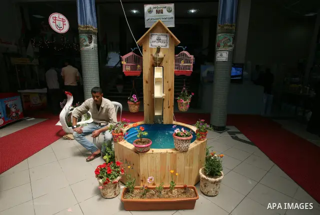 Palestinians participate in the opening of an exhibition of national products at the Islamic University in Gaza city on April 22, 2012. Photo by Naaman Omar