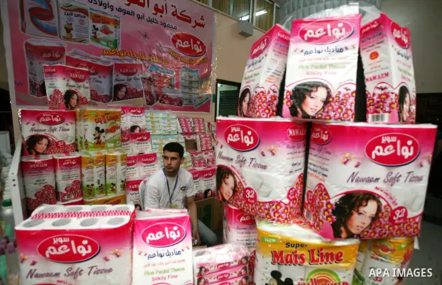 Palestinians participate in the opening of an exhibition of national products at the Islamic University in Gaza city on April 22, 2012. Photo by Naaman Omar