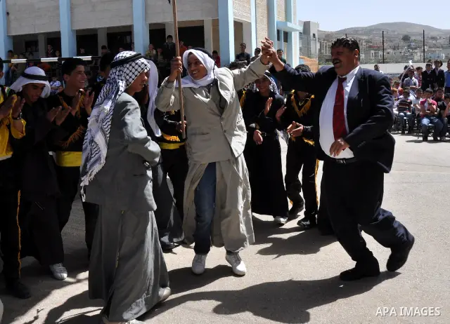 Palestinian school students dance during the Open Day Festival in the city of Nablus in the West Bank, on April,22 2012. Photo by Nedal Eshtaya