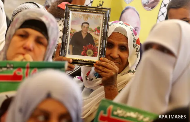 Palestinian women shout slogans during a demonstration for the release of Palestinian prisoners held in Israeli jails outside the Red Cross offices in Gaza City on April 23, 2012. At least 1,350 Palestinian prisoners bei...