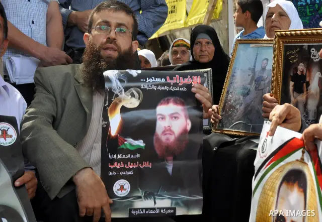 Palestinian Khader Adnan, a senior member of Islamic Jihad, who didn't eat for 66 days, was set to be freed later as part of a deal reached with Israel, attend a protest calling for the release of Palestinian prisoners h...