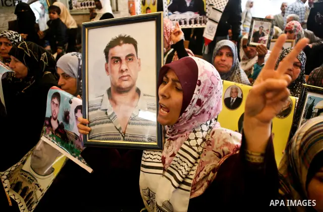 Palestinian women shout slogans during a demonstration for the release of Palestinian prisoners held in Israeli jails outside the Red Cross offices in Gaza City on April 23, 2012. At least 1,350 Palestinian prisoners bei...