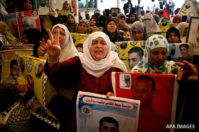 Palestinian women shout slogans during a demonstration for the release of Palestinian prisoners held in Israeli jails outside the Red Cross offices in Gaza City on April 23, 2012. At least 1,350 Palestinian prisoners bei...