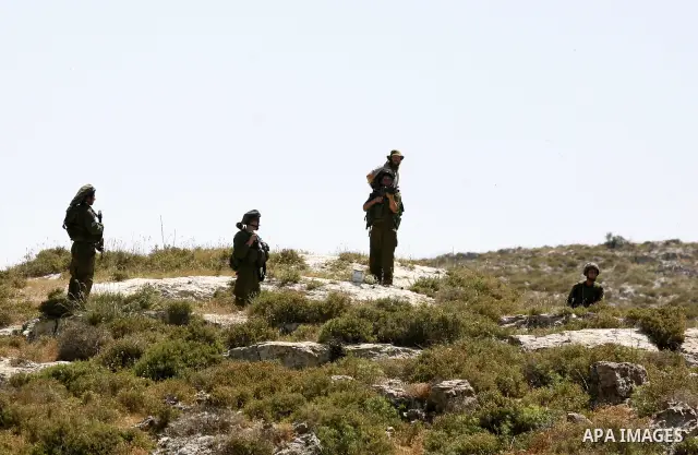 Israeli soldiers fire tear gas at Palestinian students during clashes near their school at Oref Village near the West Bank City of Nablus on 23 April 2012 .Israeli settlers from Jewish settlement of Yetshar attacked the...