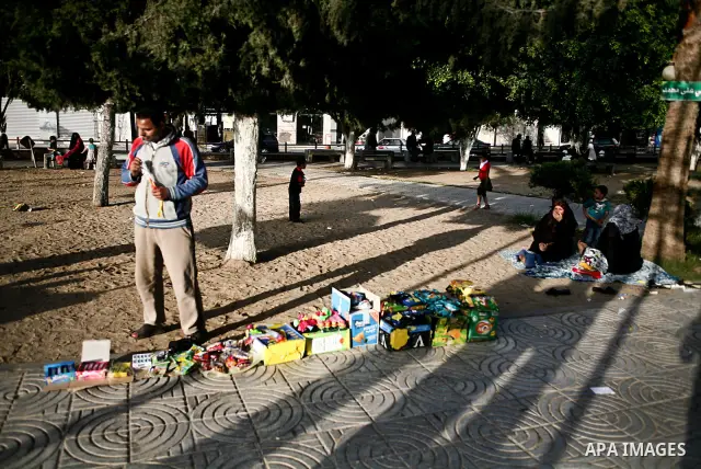 A Palestinian vendor sells drinks in a garden in Gaza city, 23 April 2012. With high rates of unemployment in Gaza strip. Photo by Ali Jadallah