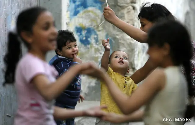 Palestinian children play in alley in front of their house in Rafah refugee camp, in the southern Gaza Strip on April 23,2011 as Gaza strip faces high unemployment. Photo by Eyad Al Baba