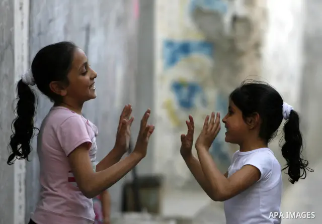 Palestinian children play in alley in front of their house in Rafah refugee camp, in the southern Gaza Strip on April 23,2011 as Gaza strip faces high unemployment. Photo by Eyad Al Baba