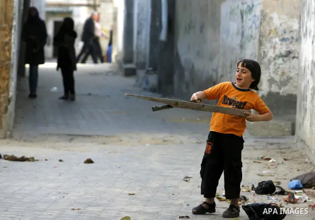 Palestinian children play in alley in front of their house in Rafah refugee camp, in the southern Gaza Strip on April 23,2011 as Gaza strip faces high unemployment. Photo by Eyad Al Baba