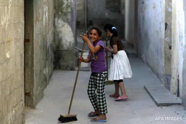 Palestinian children play in alley in front of their house in Rafah refugee camp, in the southern Gaza Strip on April 23,2011 as Gaza strip faces high unemployment. Photo by Eyad Al Baba