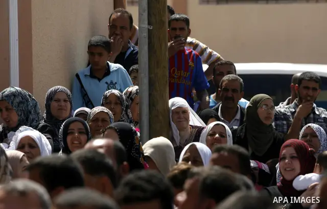 Palestinians take part a ceremony distributing new homes in Khan Younis in the southern Gaza Strip April 24, 2012. Palestinians, whose houses were destroyed during Israeli military operations in 2004 and 2005, received a...