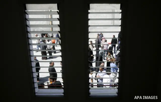Palestinians take part a ceremony distributing new homes in Khan Younis in the southern Gaza Strip April 24, 2012. Palestinians, whose houses were destroyed during Israeli military operations in 2004 and 2005, received a...
