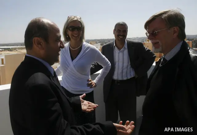 Birgitta Tazelaar head of the Netherlands Representation to the Palestinian Authority, alongside UNRWA's Filippo Grandi, during a ceremony in Khan Younis, in the southern Gaza Strip, on April 24, 2012. Palestinians whose...