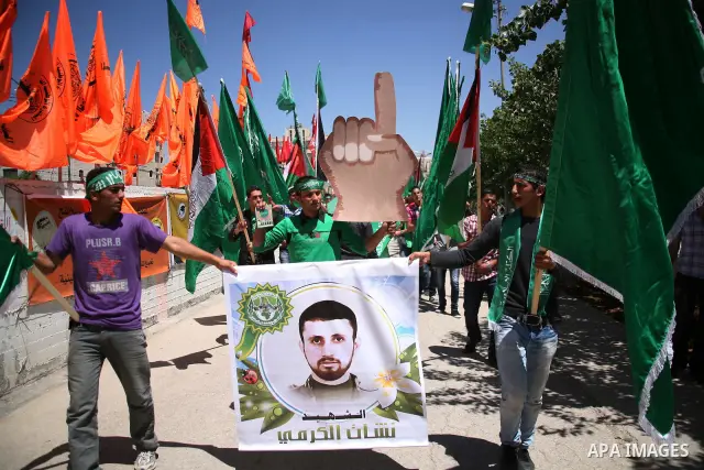 Palestinian students supporters of the Islamic group Hamas, seen during Palestine Polytechnic University. Students Council elections campaign at the Palestine Polytechnic University in the West Bank city of Hebron on Apr...
