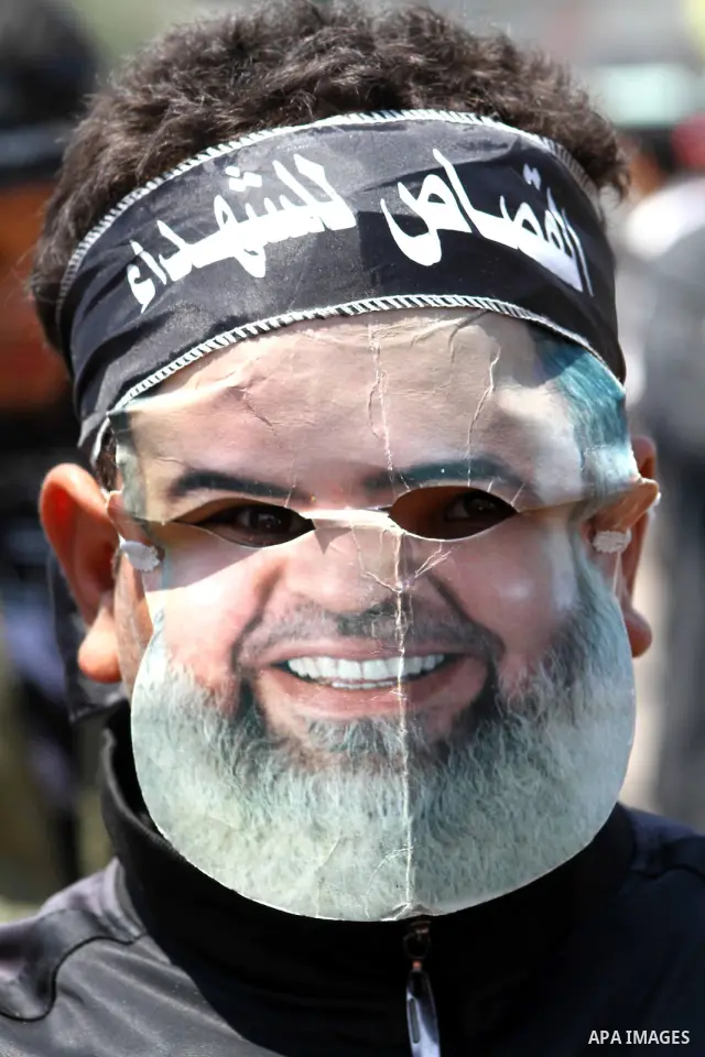 Egyptian masked man chants slogans during a protest at Tahrir Square in Cairo, Egypt on April 25, 2012. Several thousand Egyptians are protesting against the country's military rulers. Photo by Ashraf Amra