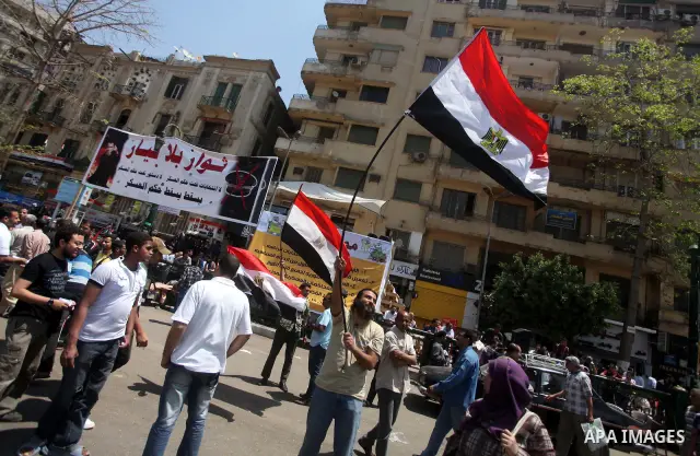 Egyptian demonstrators chant slogans during a protest at Tahrir Square in Cairo, Egypt on April 25, 2012. Several thousand Egyptians are protesting against the country's military rulers. Photo by Ashraf Amra