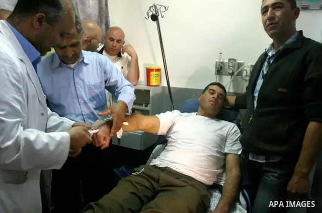 Palestinians prisoner, Tawfiq Iwisaat, in a hospital as while his release from Israeli jail after 18 years of imprisonment in the Arab east Jerusalem neighbourhood of Jabal Mukaber on April 25, 2012. Photo by Mahfouz Abu...