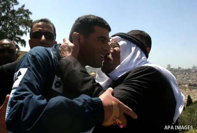 Palestinians celebrate the release of Tawfiq Iwisaat following his release from Israeli jail after 18 years of imprisonment in the Arab east Jerusalem neighbourhood of Jabal Mukaber on April 25, 2012. Photo by Mahfouz Ab...