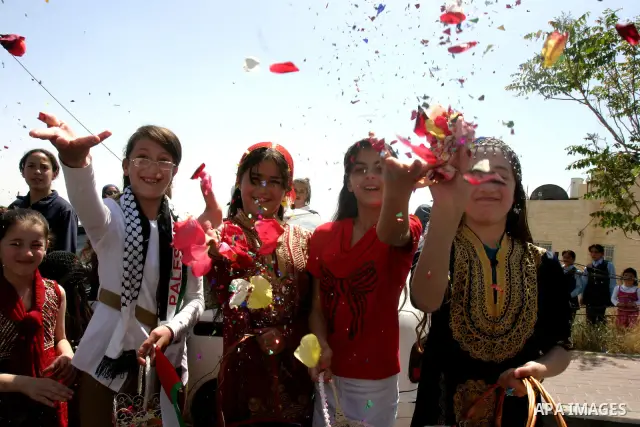 Palestinians celebrate the release of Tawfiq Iwisaat following his release from Israeli jail after 18 years of imprisonment in the Arab east Jerusalem neighbourhood of Jabal Mukaber on April 25, 2012. Photo by Mahfouz Ab...