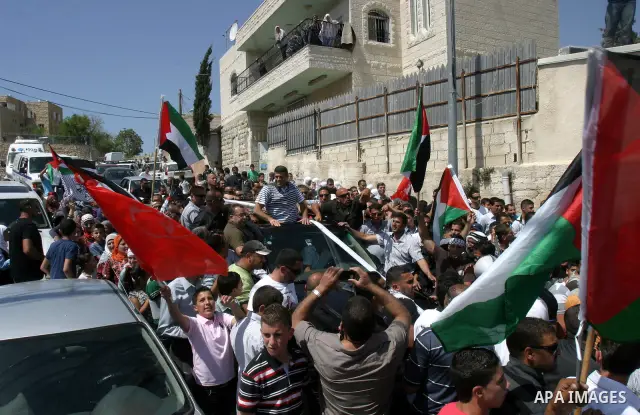 Palestinians celebrate the release of Tawfiq Iwisaat following his release from Israeli jail after 18 years of imprisonment in the Arab east Jerusalem neighbourhood of Jabal Mukaber on April 25, 2012. Photo by Mahfouz Ab...