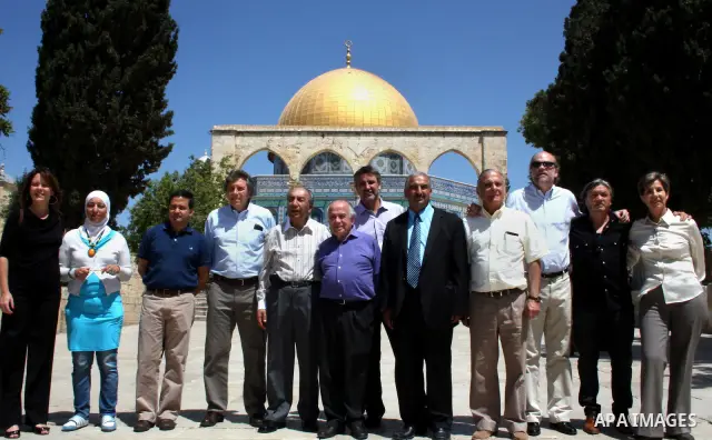 Delegation of the Chile parliament, stands near the dome of the rock mosque in the old city of Jerusalem, on April 25, 2012. Photo by Mahfouz Abu Turk