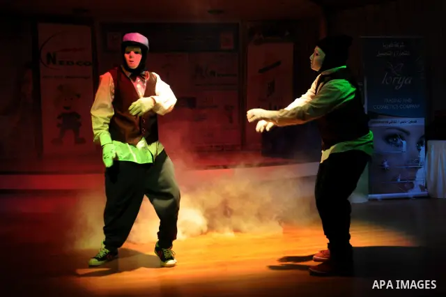 Palestinians performs dance during festival for children in the West Bank city of Nablus, on April 25, 2012. Photo by Nedal Eshtayah