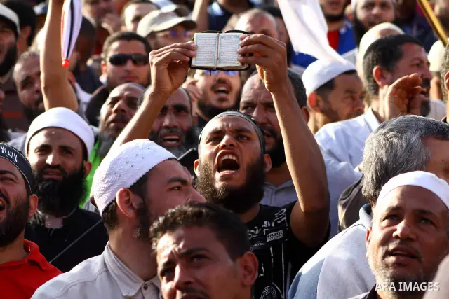 Supporters of Salafist leader and former presidential candidate Hazem Salah Abu Ismail, chant slogans against the country's military rulers during a sit-in at Tahrir Square in Cairo, April 26, 2012. Egypt's election comm...