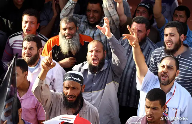 Supporters of Salafist leader and former presidential candidate Hazem Salah Abu Ismail, chant slogans against the country's military rulers during a sit-in at Tahrir Square in Cairo, April 26, 2012. Egypt's election comm...
