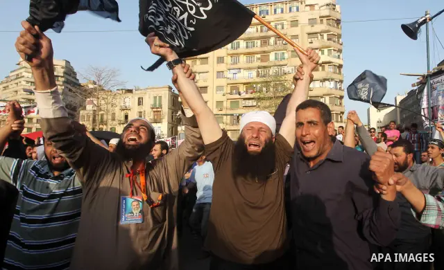 Supporters of Salafist leader and former presidential candidate Hazem Salah Abu Ismail, chant slogans against the country's military rulers during a sit-in at Tahrir Square in Cairo, April 26, 2012. Egypt's election comm...