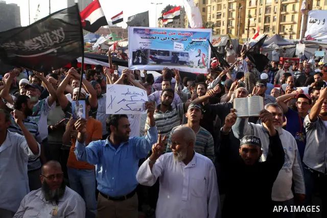 Supporters of Salafist leader and former presidential candidate Hazem Salah Abu Ismail, chant slogans against the country's military rulers during a sit-in at Tahrir Square in Cairo, April 26, 2012. Egypt's election comm...