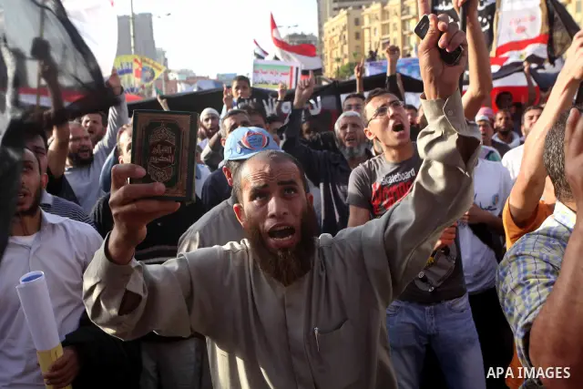 Supporters of Salafist leader and former presidential candidate Hazem Salah Abu Ismail, chant slogans against the country's military rulers during a sit-in at Tahrir Square in Cairo, April 26, 2012. Egypt's election comm...