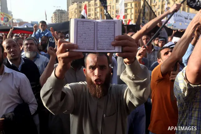 Supporters of Salafist leader and former presidential candidate Hazem Salah Abu Ismail, chant slogans against the country's military rulers during a sit-in at Tahrir Square in Cairo, April 26, 2012. Egypt's election comm...