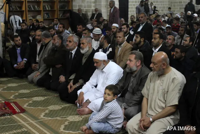 Palestinian Prime Minister in Gaza Ismail Hania, attend by Legislative Council members, Ministers and Clerics in Gaza, during a prayer for the prisoners in Israeli jails. in Gaza city on April 26, 2012.. Photo by Mohamme...