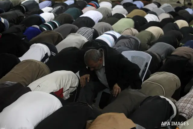 Palestinian Prime Minister in Gaza Ismail Hania (not seen), attend by Legislative Council members, Ministers and Clerics in Gaza, during a prayer for the prisoners in Israeli jails. in Gaza city on April 26, 2012.. Photo...