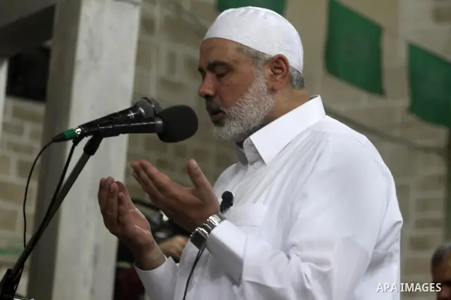 Palestinian Prime Minister in Gaza Ismail Hania, attend by Legislative Council members, Ministers and Clerics in Gaza, during a prayer for the prisoners in Israeli jails. in Gaza city on April 26, 2012.. Photo by Mohamme...