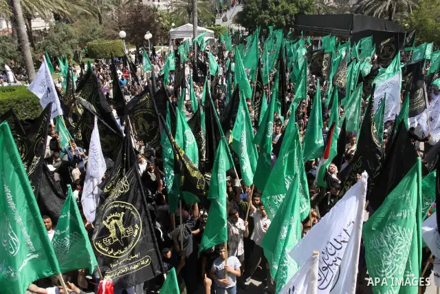 Palestinian protesters hold up banners and portraits during a protest to call for the release of Palestinian prisoners held in Israeli jails in Gaza City on April 27, 2012. Some 1,600 Palestinian prisoners held in Israel...