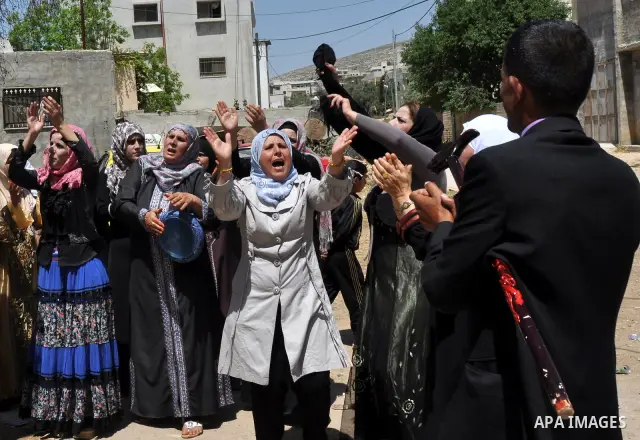 Relatives Palestinian groom Abbas Thawabteh, dancing during heritage wedding in the village of Azmut eastern city of Nablus in the West Bank,on 27 April 2012. Photo by Nedal Shtieh. Photo by Nedal Shtieh